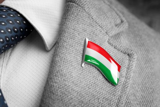 Metal badge with the flag of Hungary on a suit lapel