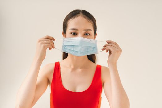 Woman suffer from cough with face mask protection.