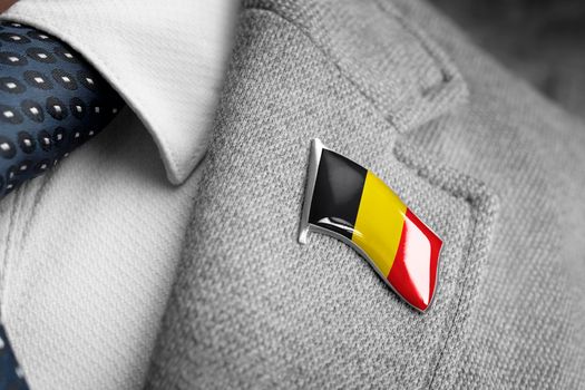 Metal badge with the flag of Belgium on a suit lapel