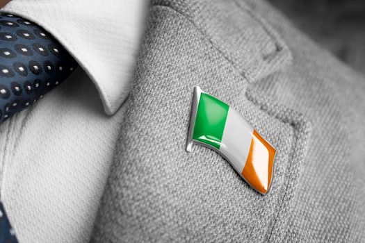 Metal badge with the flag of Ireland on a suit lapel