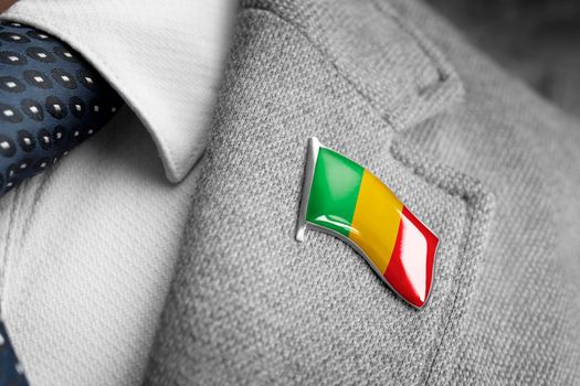 Metal badge with the flag of Mali on a suit lapel