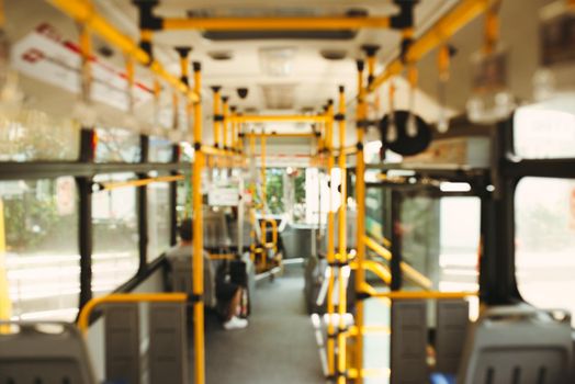 Public transportation. Blur image of interior of modern city bus