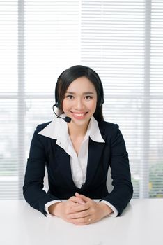 Call center operators. Young beautiful business woman in headset