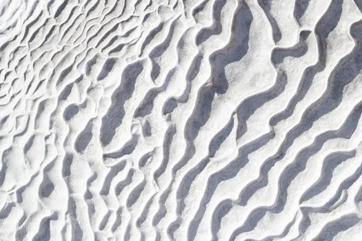 White and gray texture of calcium travertine, pattern of waves