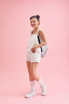 Pretty student lady first day after summer holidays wear casual outfit isolated pink background