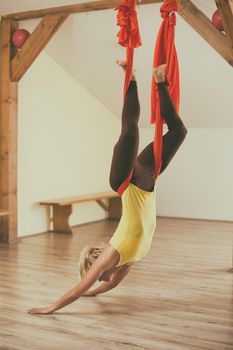 Woman doing aerial yoga
