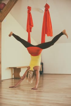 Woman doing aerial yoga