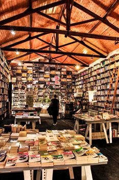Old bookstore with shelves full of books in Obidos