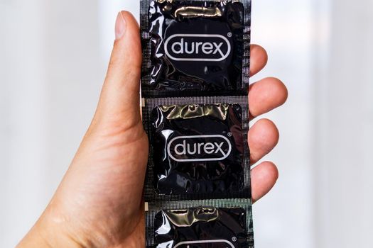 Tyumen, Russia-april 22, 2021: Durex condoms in hand. It is used for the prevention of sexually transmitted diseases. Health Concepts