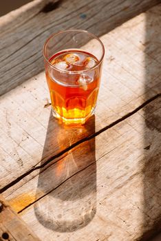 southern style iced sweet tea in two glasses rustic wooden table