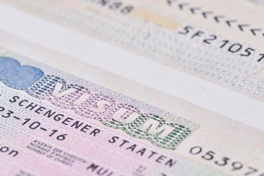 Schengen visa in passport. Close-up