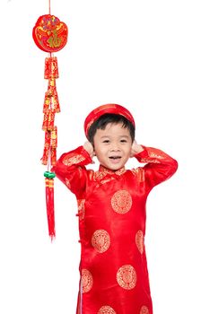 Portrait of a funny and exciting Vietnamese boy with firecrackers. Asian Kid Celebrating New Year