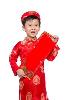 Vietnamese Boy Kid congratulating with his New Year. Happy Lunar New Year.
