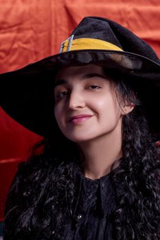 Portrait of a cute multi-racial woman in witch cap