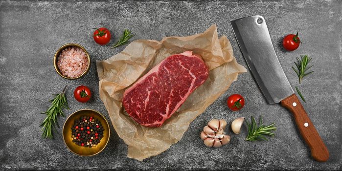 Close up raw beef sirloin steak on board