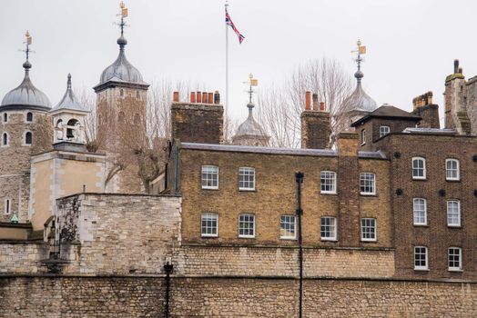 Tower of London castle architecture. compasses and flags