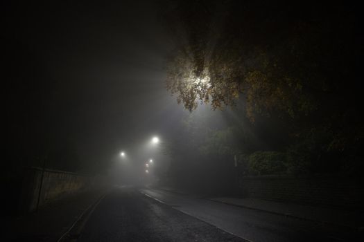 Deserted and spooky glossop road in sheffield, heavy fog during night