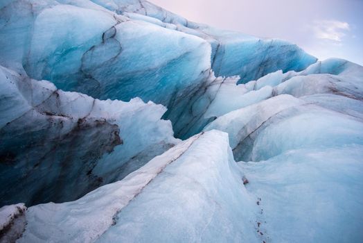 Icelandic glacier with volcanic ash close up sharp edges