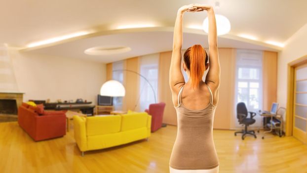 Young slim woman doing yoga asana at home