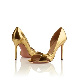 Pair of golden women shoes