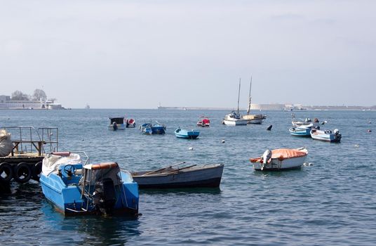 Boats anchored in the black sea in sunny moring
