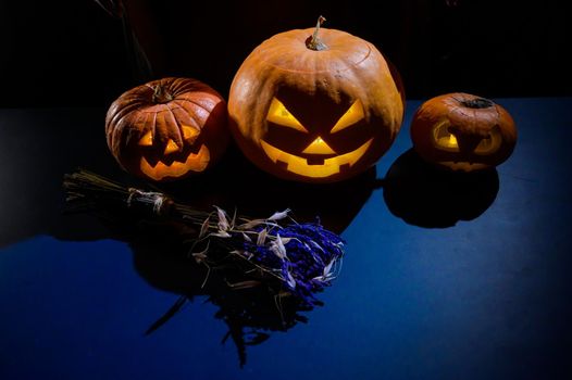 Image of several halloween jack o lanterns glowing in the dark