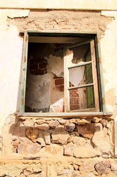 Broken and damaged window in an old house