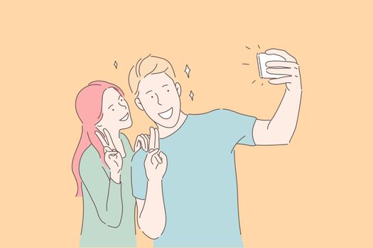 Making selfie, smiling couple, victory gesture concept