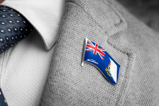 Metal badge with the flag of Cayman Islands on a suit lapel