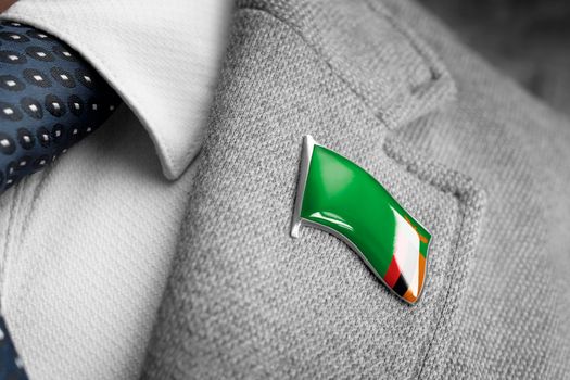 Metal badge with the flag of Zambia on a suit lapel