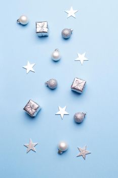Christmas silver decorations on blue background