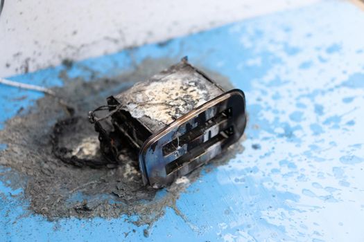 Toaster after fire. Household electrical appliance fire hazard