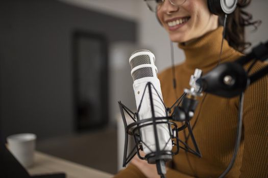 woman broadcasting radio while smiling. High quality beautiful photo concept