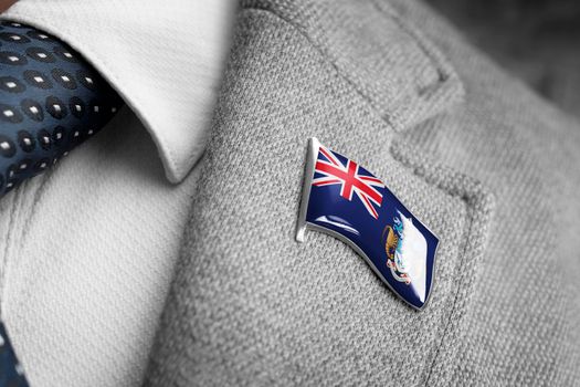 Metal badge with the flag of Tristan da Cunha on a suit lapel
