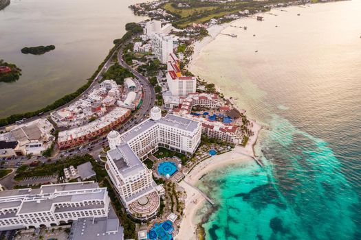 Aerial panoramic view of Cancun beach and city hotel zone in Mexico. Caribbean coast landscape of Mexican resort with beach Playa Caracol and Kukulcan road. Riviera Maya in Quintana roo region on Yucatan Peninsula