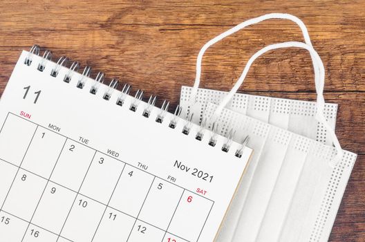 November 2021 desk calendar with surgical mask medical.