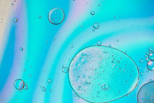 Holographic colorful abstract background with oil drops on water. Abstract background with colorful gradient colors. DOF