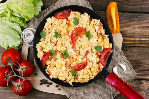 flat lay scrambled eggs with tomatoes