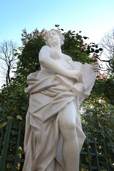 Marble statue of the allegory of mercy in the Summer Garden, Saint-Petersburg, Russia.