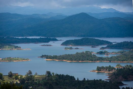 El Penon de Guatape looking out at layers of beautiful land water and terrain.