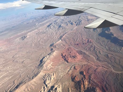 Window view of airplane wing of western United States ripple texture