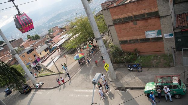 Cable car hanging above houses Medellin, Colombia.