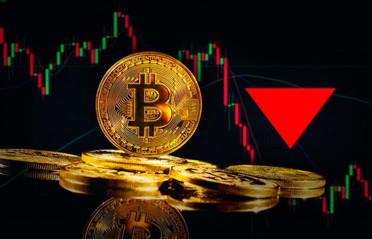 Crypto collapse. Golden coins with bitcoin logo drop at bear market. Pullback of leader cryptocurrency Bitcoin BTC in trading. Decentralized digital currency fell. Electronic money on black background