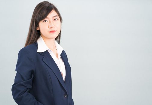 Portrait of asian businesswoman isolated on gray