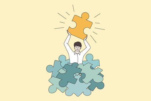 Happy man hold jigsaw puzzle find business solution