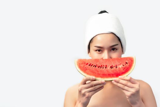 Asian beauty woman holding watermelon on white background. Beauty and Fashion concept. Medical and Healthcare theme. People lifestyle portrait. Food and drinks concept