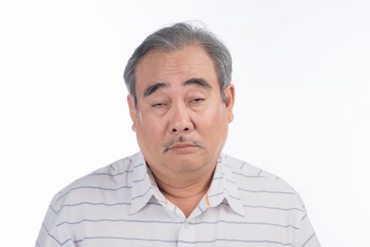 Weary asian man is exhausted. He is tired of listening his wife chatting