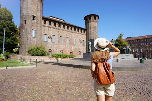 Traveler exploring the city of Turin in Italy. Woman walking and discovering old landmark in Europe. Travel lifestyle. Summer vacation.