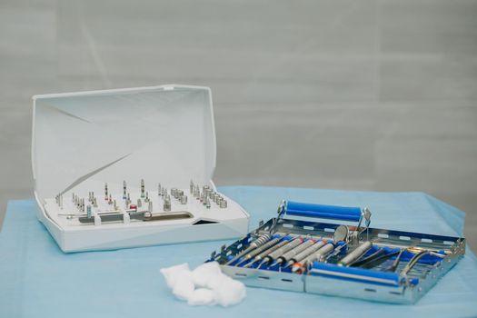 Surgical kit of instruments used in dental implantology. Dentist orthopedist tools. Dentistry. Dental implantation surgical set