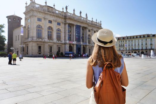 Cultural tourism in Europe. Back view of female tourist visiting Turin, Italy.